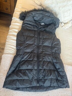 The North Face Women's Black Quilted Hooded Puffer Vest with removable hood